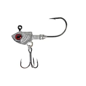 Close-up detail of fishing jig head hook with red eye and treble hook for lure fishing.