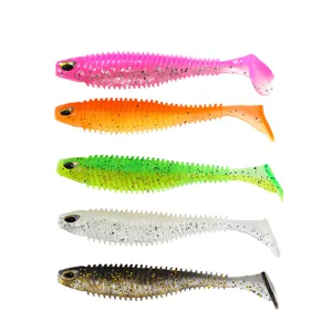 Colorful T-tail soft fishing lures with 3D eyes and ribbed bodies for bass trout fishing.