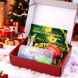 Detailed view of Christmas fishing gear gift set with lure box and soft baits inside red box.