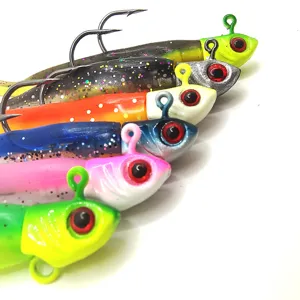 Soft plastic fishing lure with jig head and paddle T-tail for saltwater freshwater fishing.