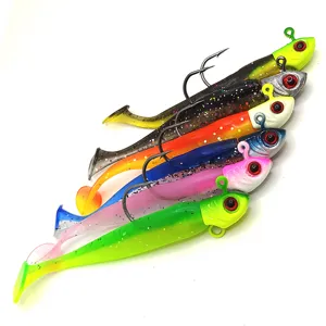 Colorful T-tail soft fishing lures with lead jig heads for saltwater freshwater fishing.