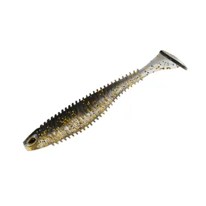 Close-up detail of the ribbed paddle tail soft fishing lure with sparkling gold glitter.