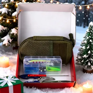 Detail view of the Christmas fishing gear gift set in a festive snow-covered box scene.