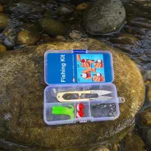 Portable outdoor fishing kit with tackle box, scissors, bobbers, and lures for angling adventures.