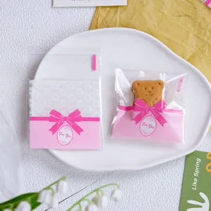 Transparent self-adhesive baking cookie bags with pink bow for DIY pastry gifts 100pcs
