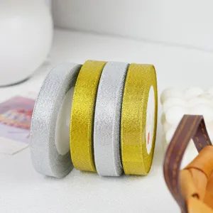 Gold and silver metallic glitter ribbon rolls for gift wrapping, cake box and craft decor.