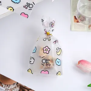 Gefrostete süße Cartoon-Geschenktüten mit Bindedraht, ideal für Kekse und kleine Präsente.