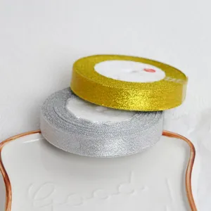 Gold and silver glitter ribbon for gift wrapping, cake packaging and craft decoration.