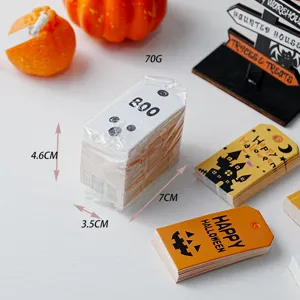 Halloween gift tags detail view, paper hanging labels with pumpkin ghost castle design