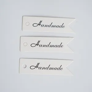 Handmade DIY blank gift tags swallowtail paper labels for jewelry craft packaging detail.