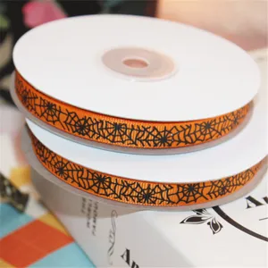 Halloween orange grosgrain ribbon with black spider web design for gift wrapping and crafting.