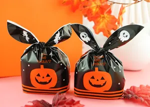 Halloween rabbit ear candy gift bag, black plastic treat packaging with pumpkin design.