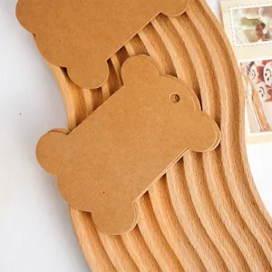 Kraft paper bone shape tags blank paper cards DIY handmade hanging gift labels detail view