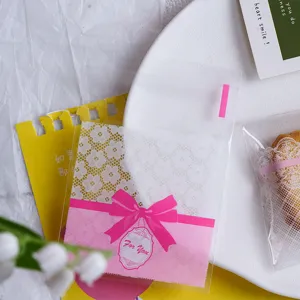 Food grade baking packaging bag detail showing pink bow design and translucent lace texture.