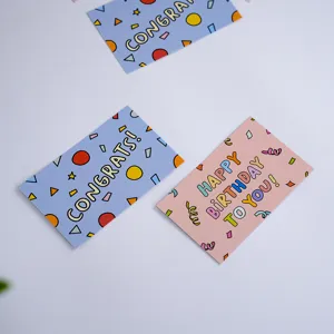 Cute pink and blue birthday greeting cards with fun cartoon geometric designs for gifts.