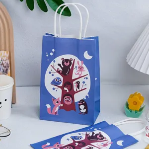 Close up of cartoon animal gift paper bag, cute tree pattern with blue design and white handles.