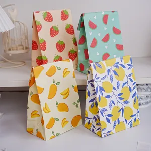 Close-up of colorful paper gift bags featuring cute fruit patterns like strawberry and lemon.