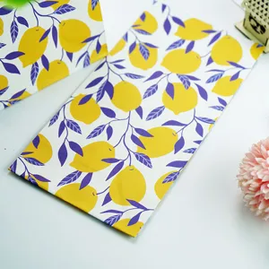 Lemon print paper gift bags detail view, ideal for candy and party favors packaging.