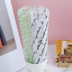 Papel de envolver antigrasa con estampado de letras francesas, mantel elegante.
