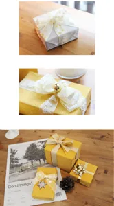 Christmas gift boxes wrapped in shiny paper with organza ribbons featuring trees and stars.