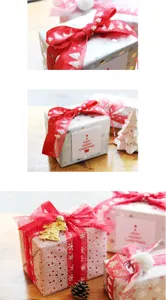Close-up details of Christmas gift packaging boxes with red organza ribbons and festive decorations.