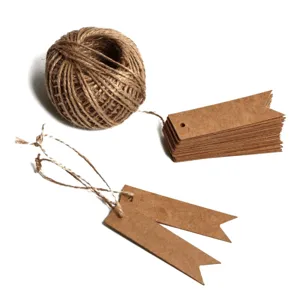 Detail view of natural jute twine and blank brown kraft paper swallowtail gift tags.