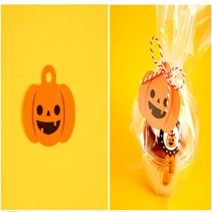 Halloween pumpkin paper tags DIY gift packaging decorative labels with cute jack-o-lantern face.