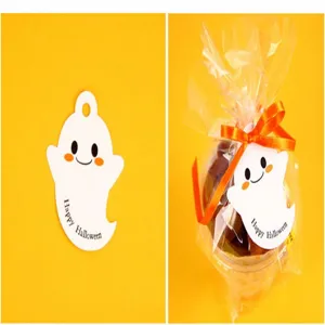 Halloween ghost paper tag detail, cute ghost gift hanging tag, holiday party DIY packaging decoration.