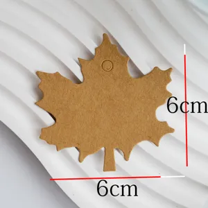 Maple leaf shaped kraft paper tag detail showing size, blank DIY jewelry gift card.