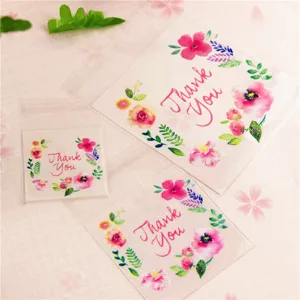 Transparente selbstklebende Geschenktüten mit Aquarell Blumen Danke Aufdruck für Gastgeschenke.