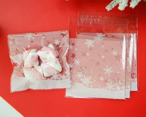 Christmas snowflake self-adhesive cookie packaging plastic bags detail shot for holiday gifts.
