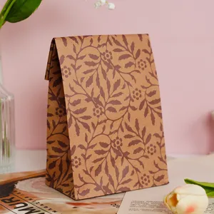 Vintage brown kraft paper gift bag with botanical leaf pattern, elegant flat mouth design.
