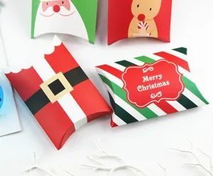 Christmas pillow paper boxes for cookie and nougat packaging with cute Santa and reindeer design.