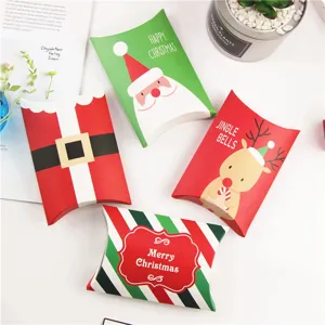 Detailed view of Christmas pillow boxes, festive paper packaging for cookies and treats.