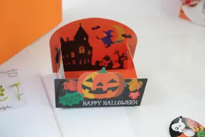 Scatola di imballaggio alimentare in carta di Halloween con design di zucca per festa