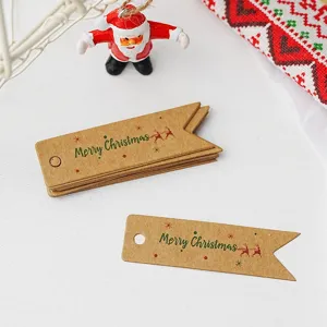 Retro kraft paper swallowtail Christmas gift tags with Merry Christmas print detail.