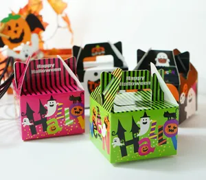 Detailed view of colorful Halloween paper gift boxes featuring cute ghost and pumpkin patterns.