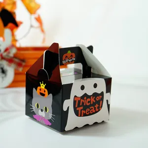 Detail view of Halloween portable treat paper box with cute ghost and cat graphics.