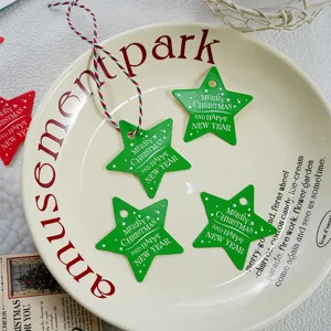 Christmas tree star shaped hanging tags set detail view with red and white strings.