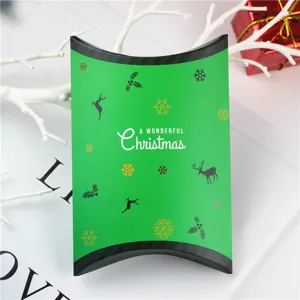 Scatola a cuscino di natale verde per caramelle biscotti e regali imballaggio stile festivo.
