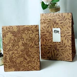 Vintage leaf pattern kraft paper gift bag detail, rustic retro floral design for packaging.