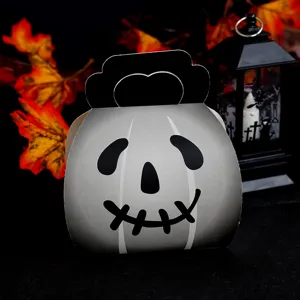 Halloween candy box detail view, spooky ghost pumpkin paper packaging for kids party treats.