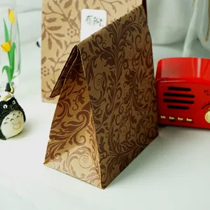 Vintage leaf pattern brown paper gift bag, flat mouth retro packaging bag for shopping.