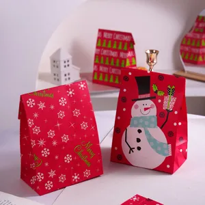 Christmas gift paper bags, festive red design with cute snowman and snowflake patterns.