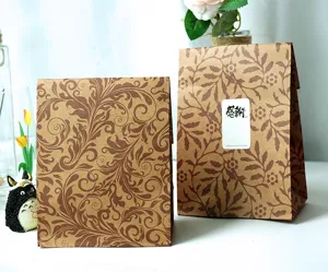 Retro kraft paper gift bags with elegant leaf vine pattern, perfect for shopping and party packing.
