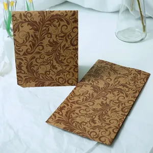 Vintage leaf pattern kraft paper gift bag detail, flat mouth retro style shopping packaging.