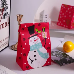 Christmas paper gift bag cute snowman design red holiday present packaging detail item.