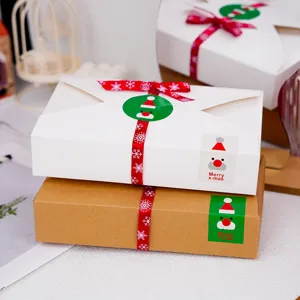 Scatola regalo Natale stile busta confezione kraft per biscotti con nastro rosso e Babbo Natale.