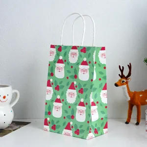 Green Christmas Santa paper gift bag with white handles for holiday party favors and gifts.