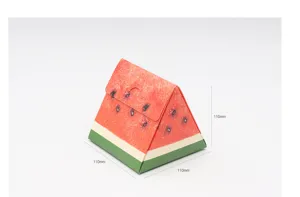 Detail shot of creative watermelon shaped triangle paper box for cookies and candy packaging.